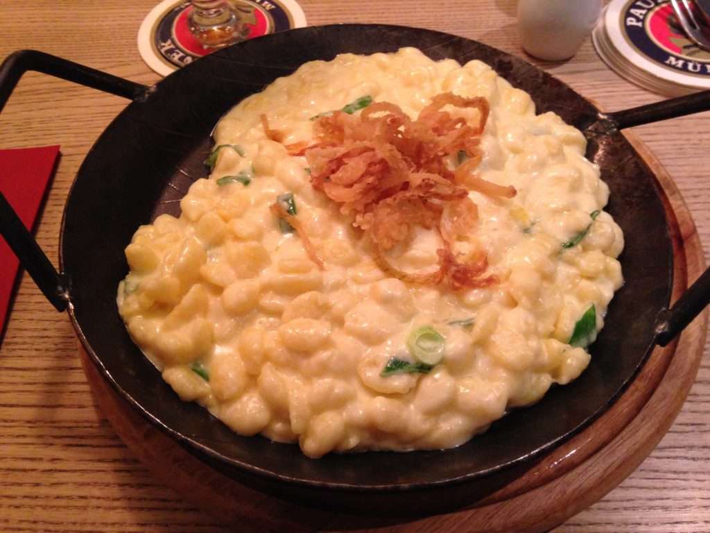 Spätzle with crunchy onions in a hot skillet.